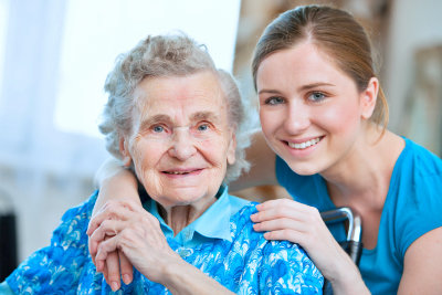 senior woman with her caregiver at home